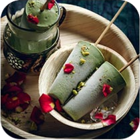 Three greenish cone icecream on plate