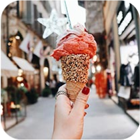 Streetwiew with big rosish icecream in hand